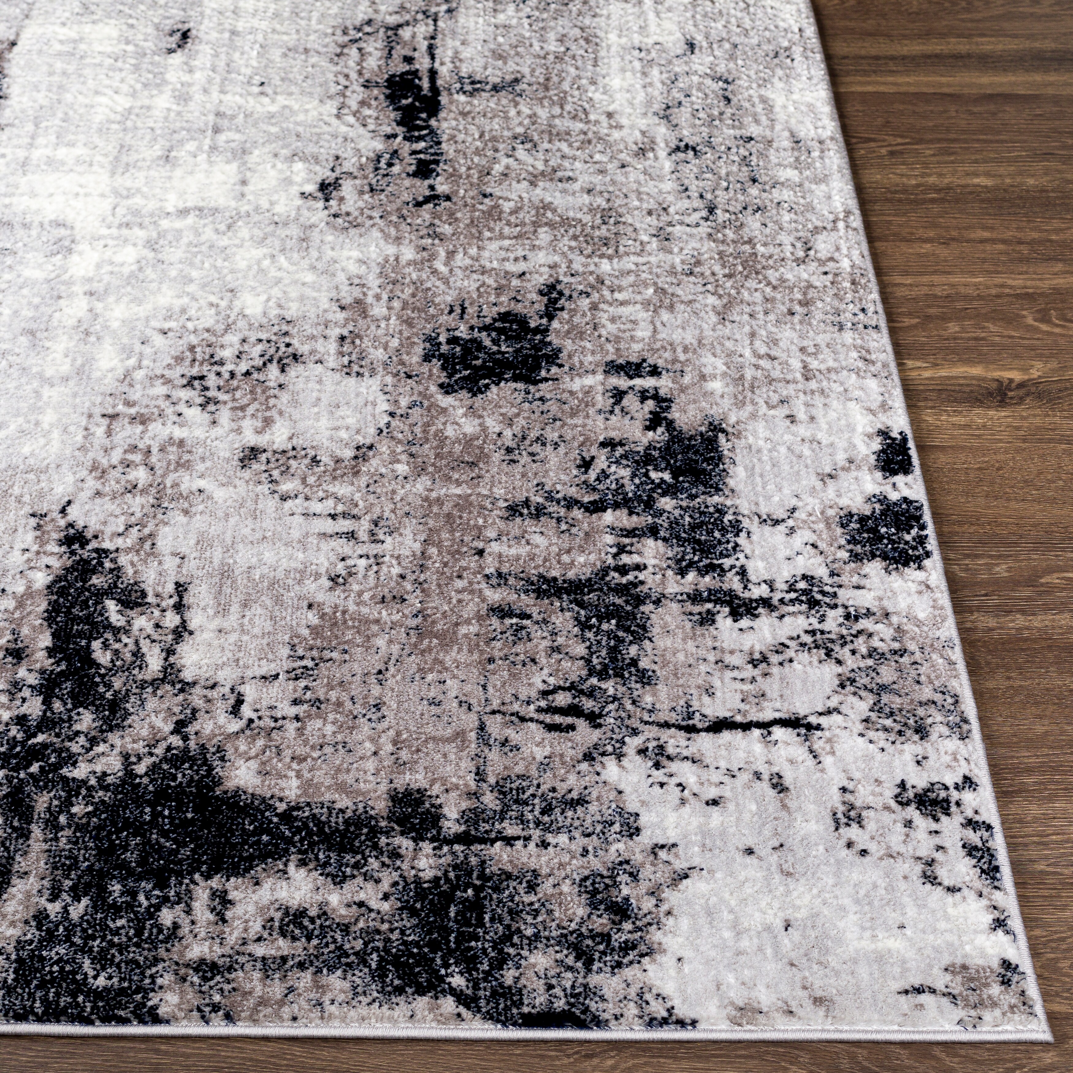 https://ak1.ostkcdn.com/images/products/is/images/direct/782783a0baa621eb267aa36ca77a97fcd50f39bc/Cooke-Industrial-Abstract-Polyester-Area-Rug.jpg