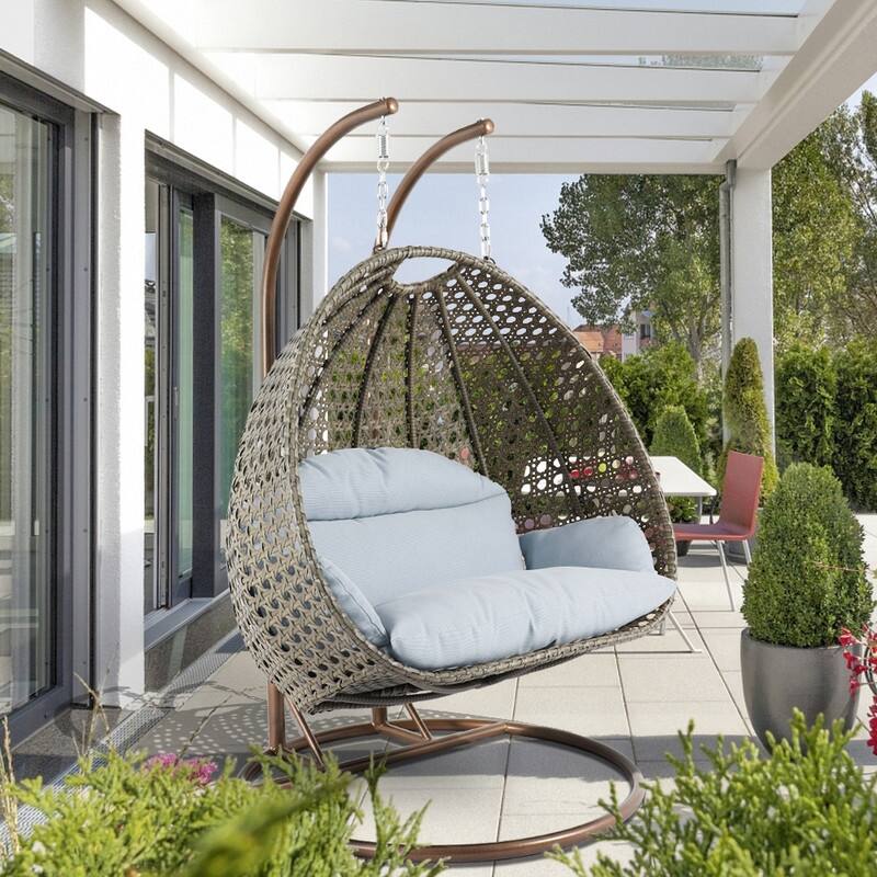 LeisureMod Modern 2-Person Egg Hanging Swing Chair with Beige Wicker, Oxford Fabric Cover, Patio Hammock Lounger and Cushions