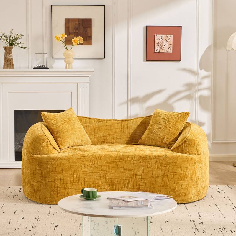 Curved 2 person compress sofa. It has armrests on both sides, comes with two pillows,is suitable for small - sized apartments