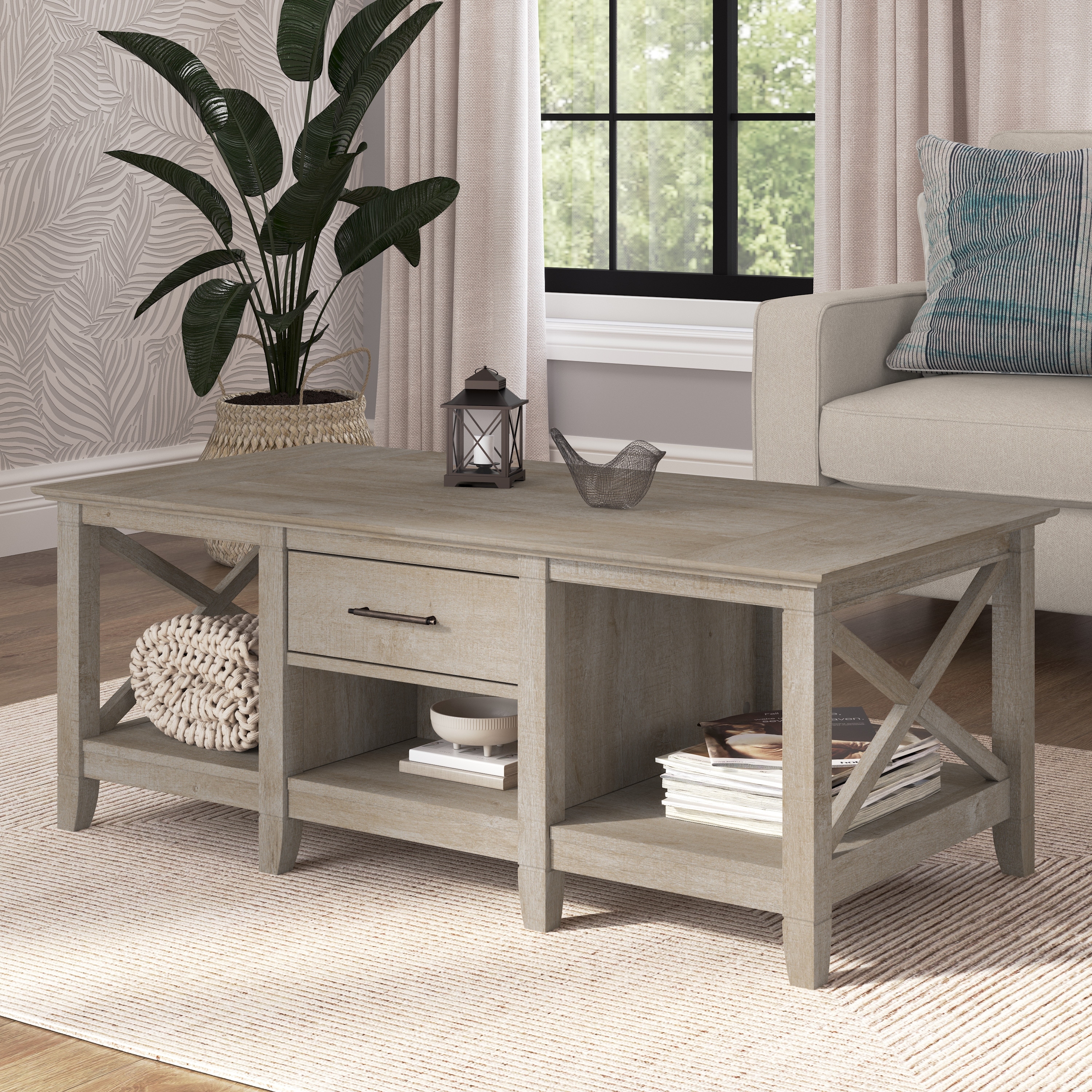 https://ak1.ostkcdn.com/images/products/is/images/direct/7946be44a8fa943aed9a6cc63343cca6138e2b94/Key-West-Coffee-Table-with-Storage-by-Bush-Furniture.jpg