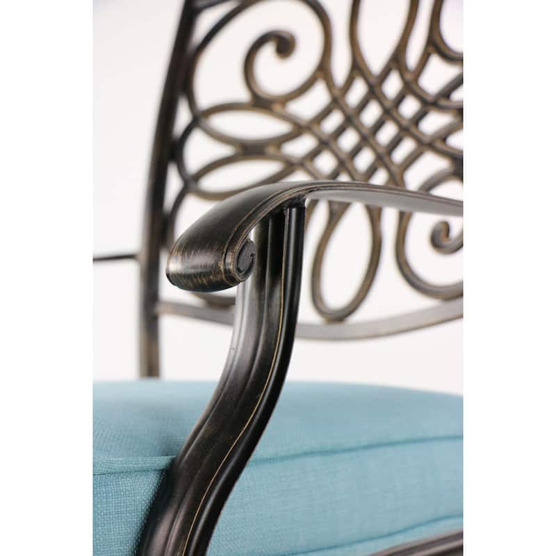 Hanover Traditions 7-Piece Dining Set in Blue with a 60 In. Round Cast-top Table and Six Swivel Rockers