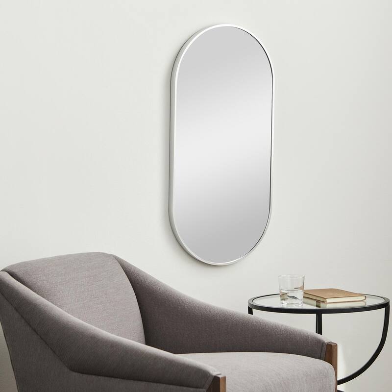Livabliss Aranya Modern Aluminum Oval Pill-Shaped Accent Mirror - 16"H x 32"W x 1.1"D - Silver