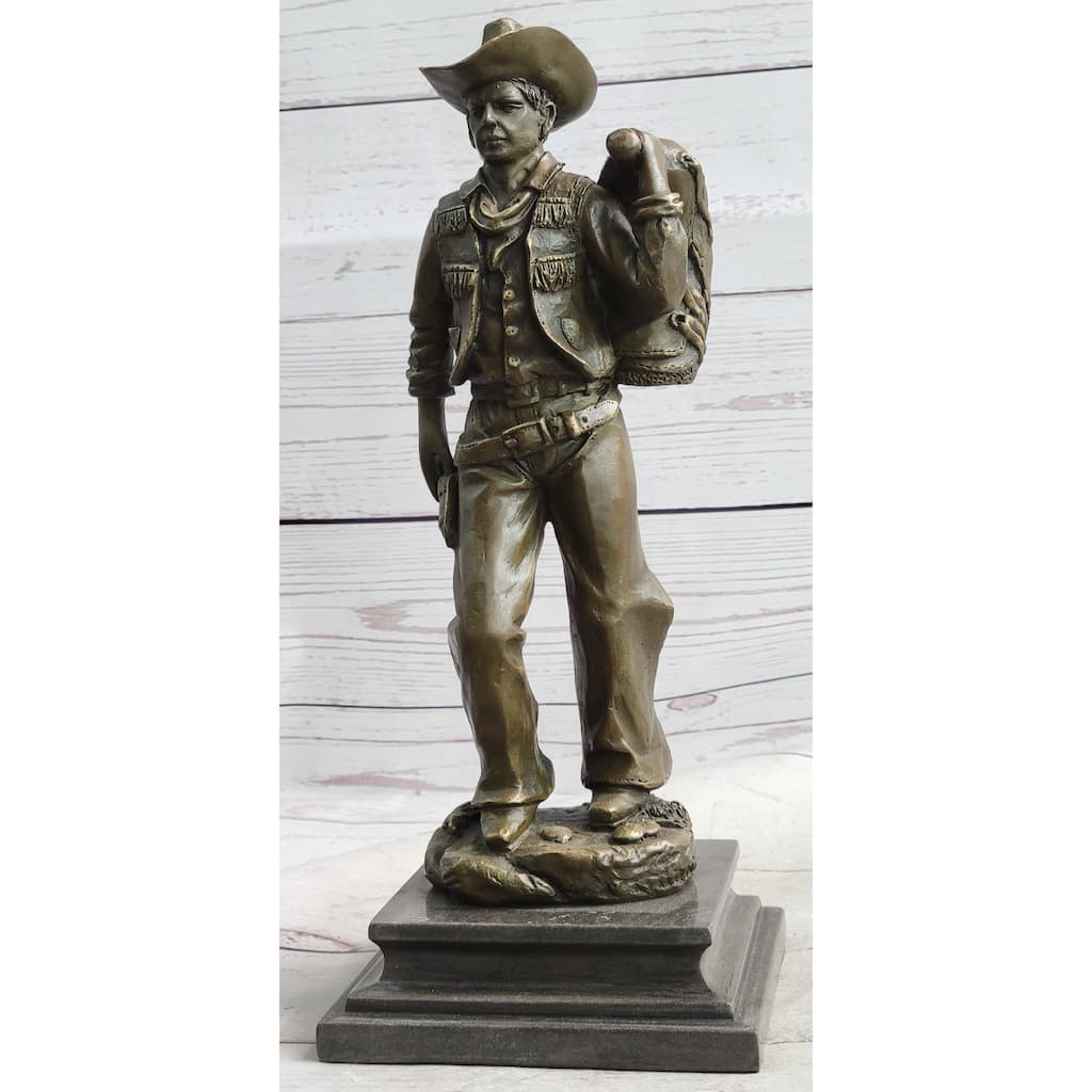 Country Western Cowboy In Chaps Carrying Imitative Horse Saddle Bronze Statue Sculpture Figure 12 Inches X 4 Inches