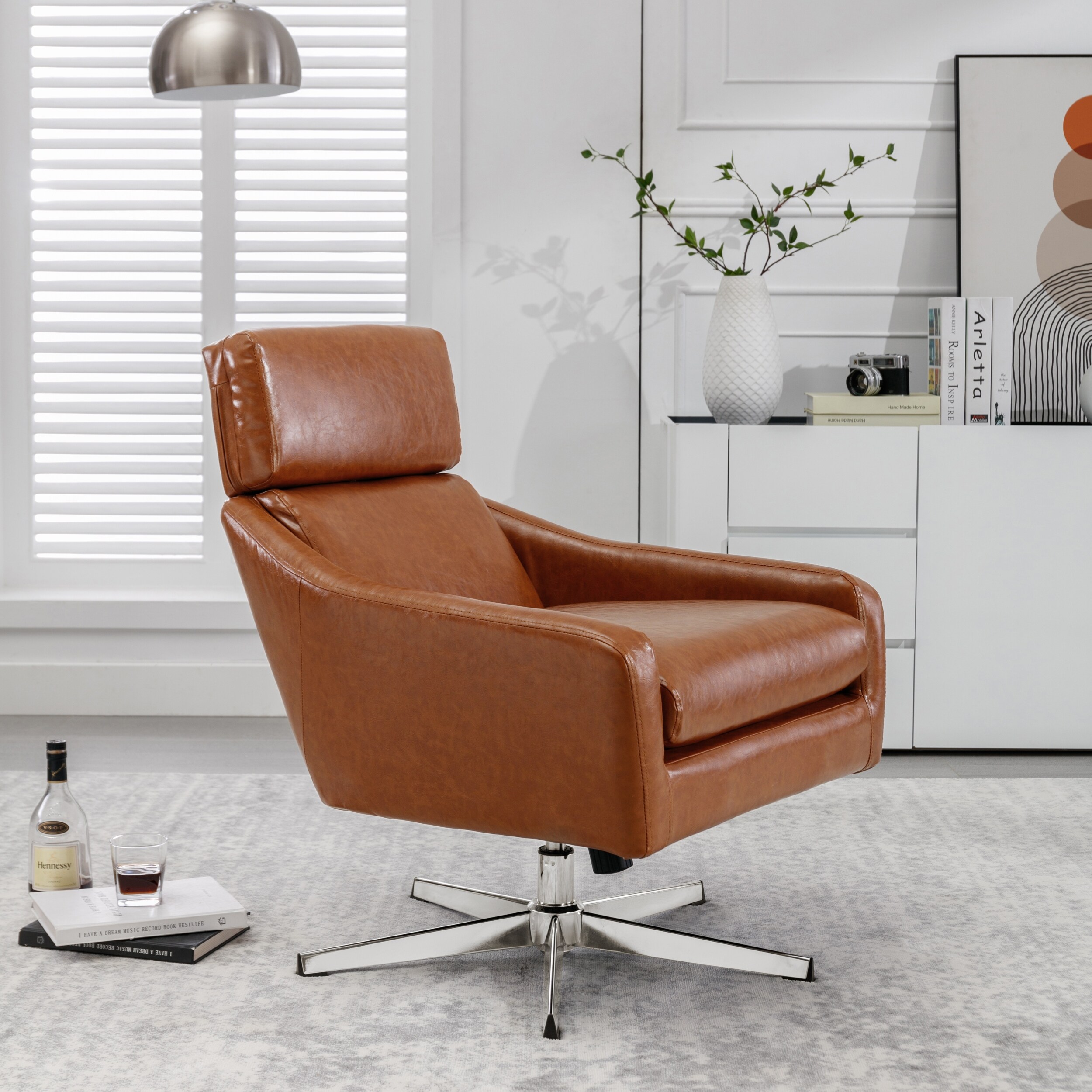 Leather swivel sales armchair with footstool