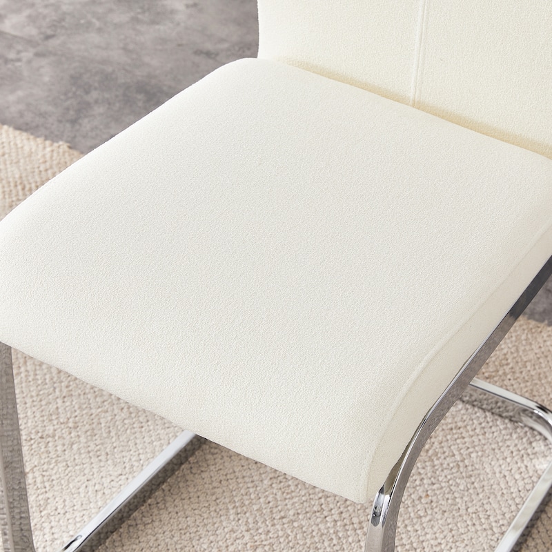 Luxury - style Dining Chairs.The combination of white grainy fabric-like fabric and silver metal legs is stylish.Set Of 2.