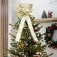 preview thumbnail 2 of 6, Sparkling Champagne Gold Santa Hat Tree Topper with Bow & Snowflakes - 25cm Festive Decor for Xmas Tree & Tabletop.