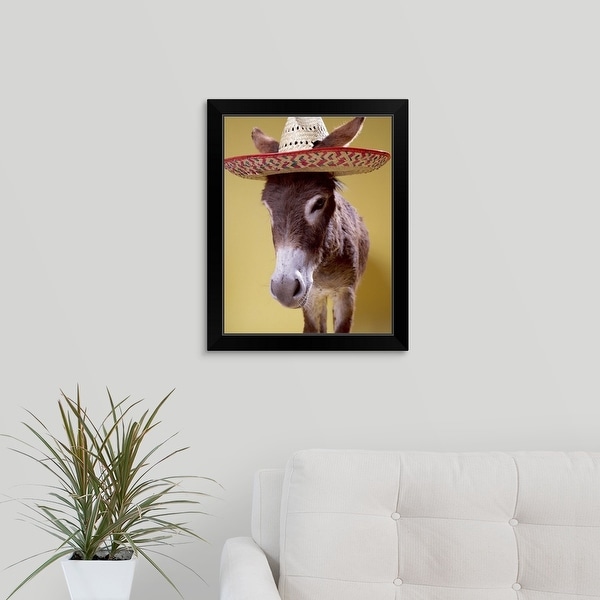 "Donkey (Equus hemonius) wearing straw hat" Black Framed Print