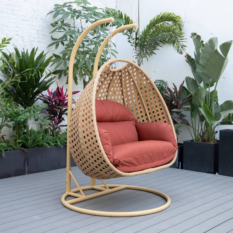 LeisureMod Mendoza 2-Person Hanging Egg Swing Chair - Handcrafted Light Brown Wicker, Patio Hammock Lounger with Cushions - 53"