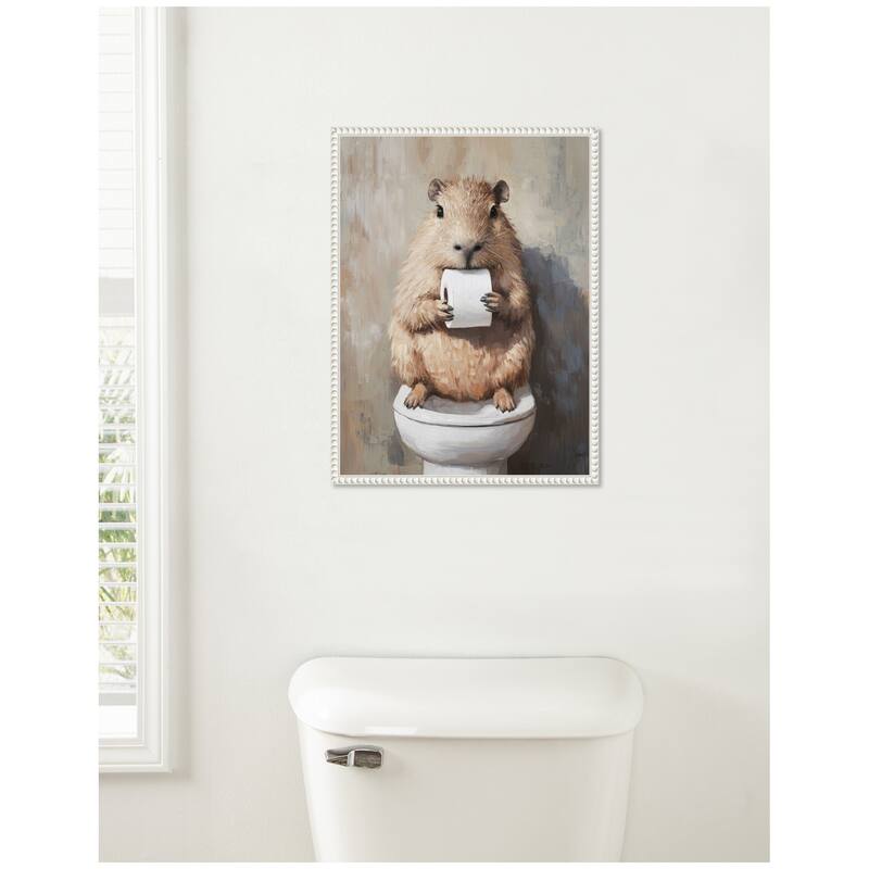 Kate and Laurel Sylvie Capybara Holding Toilet Paper Roll Toilet Bathroom Art Framed Canvas by The Creative Bunch Studio