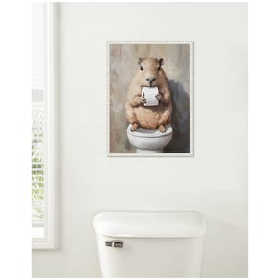 Kate and Laurel Sylvie Capybara Holding Toilet Paper Roll Toilet Bathroom Art Framed Canvas by The Creative Bunch Studio