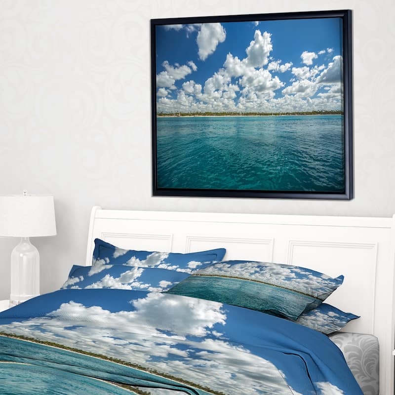 Designart "White Fluffy Clouds Over Sea" Oversized Beach Framed Canvas Artwork Print