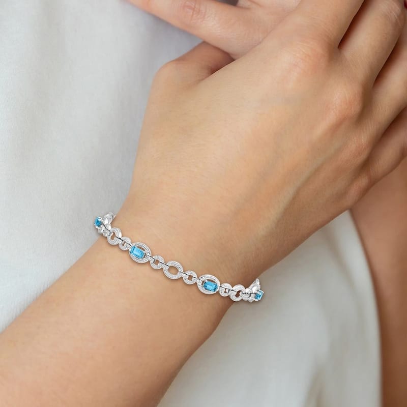 Curata 925 Sterling Silver Textured Polished Box Catch Closure Diamond and Lt Swiss Blue Topaz Oval Link Bracelet