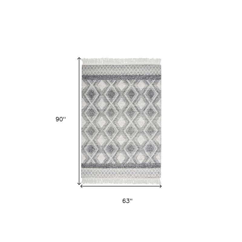 Niyo Geometric Modern Woven with Fringe Area Rug By HomeRoots - 90' X '63' X '0.5