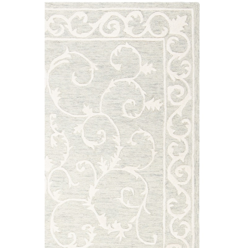 SAFAVIEH Handmade Micro-Loop Tomke Wool Rug