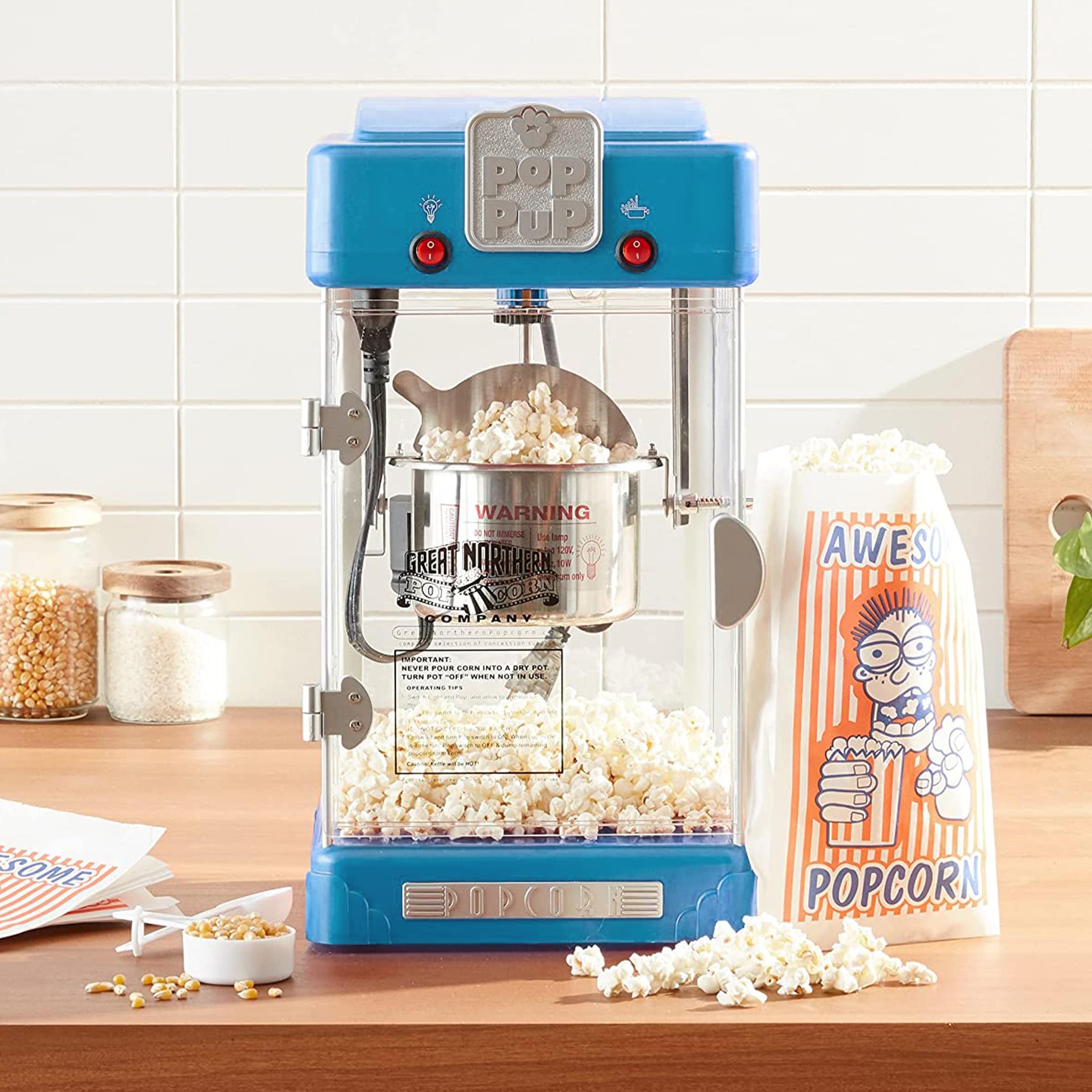 https://ak1.ostkcdn.com/images/products/is/images/direct/7d258ea26328298275478e63f72bef1cd98d93f5/Pop-Pup-Countertop-Popcorn-Machine-%E2%80%93-2.5oz-Kettle-with-Measuring-Spoon%2C-Scoop%2C-and-25-Serving-Bags-%28Blue%29.jpg