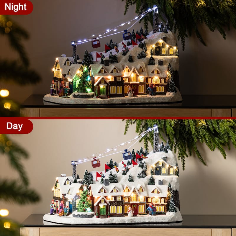 Glitzhome 16"H Christmas Oversized Resin Lighted Musical Skiing Table Village Decor