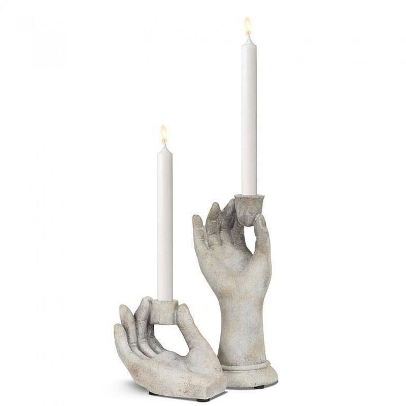 Hand Holding Between Fingers Taper Candle Holder
