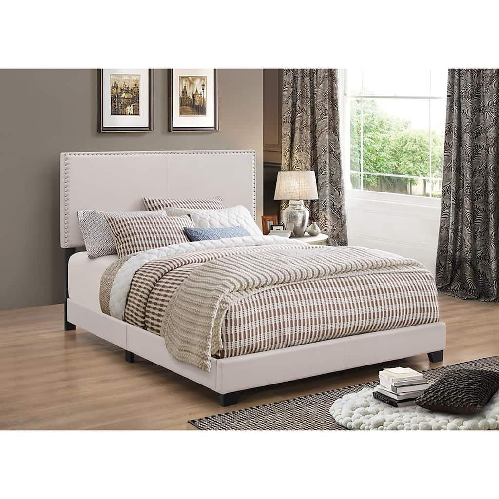 Elegant Ivory Upholstered Twin Bed with Chrome Nailhead Trim and Black Wooden Legs