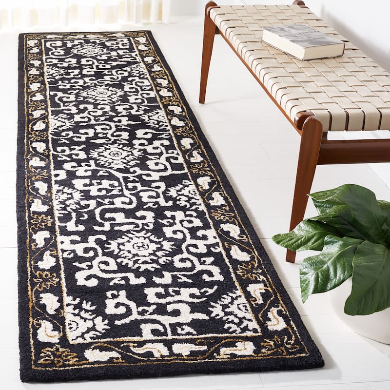 SAFAVIEH Handmade Antiquity Lauresha Wool Rug - 2'3" x 9' Runner - Black/Ivory