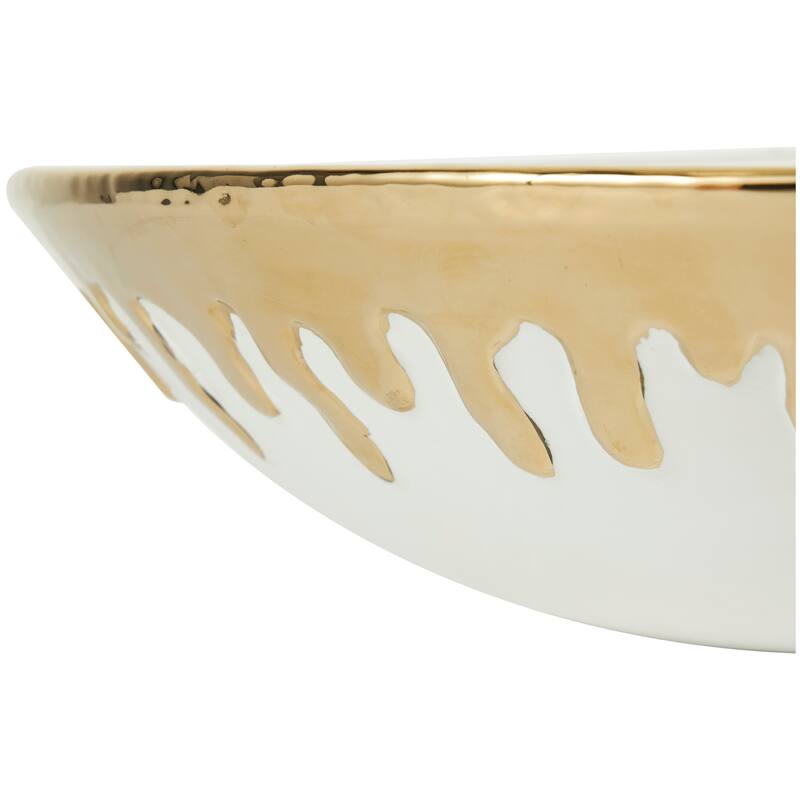 CosmoLiving by Cosmopolitan Black or White Ceramic Decorative Bowl with Abstract Gold Melting Drips