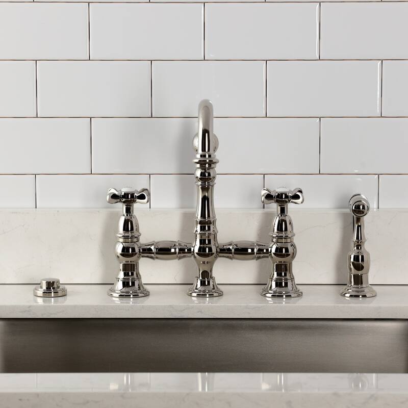 Kingston Brass Essex Two-Handle 4-Hole Deck Mount Bridge Kitchen Faucet with Brass Side Sprayer