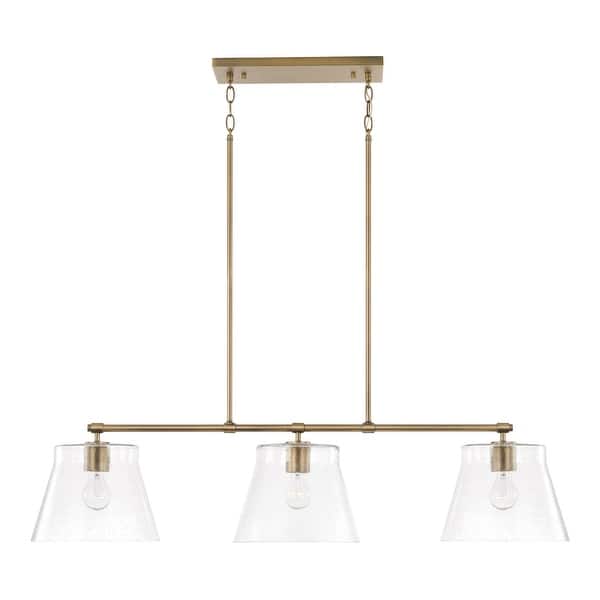 slide 2 of 4, Baker 3-light Island Fixture/ Linear Chandelier Aged Brass