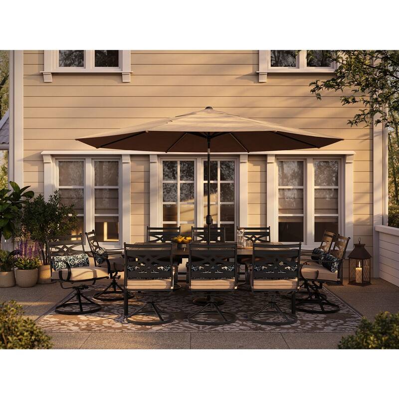 Hanover Montclair 11-Piece Dining Set in Tan with 10 Swivel Rockers, 60-In. x 84-In. Table, 11-Ft. Umbrella and Umbrella Stand