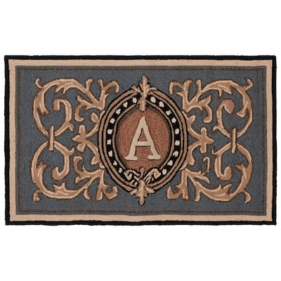 SAFAVIEH Handmade Monogram Irmengard Casual Rug