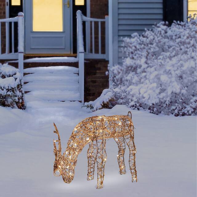 Alpine Corporation Outdoor Rattan Grazing Christmas Reindeer Lawn Decoration with White Halogen Lights - 24 in. - Brown
