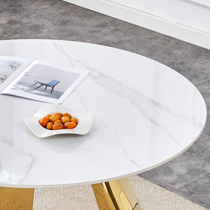 A 42-Inch Round Dining Table With Cast Iron Base And Stainless Steel Legs, Paired With Four White-Gray Striped Dining Chairs
