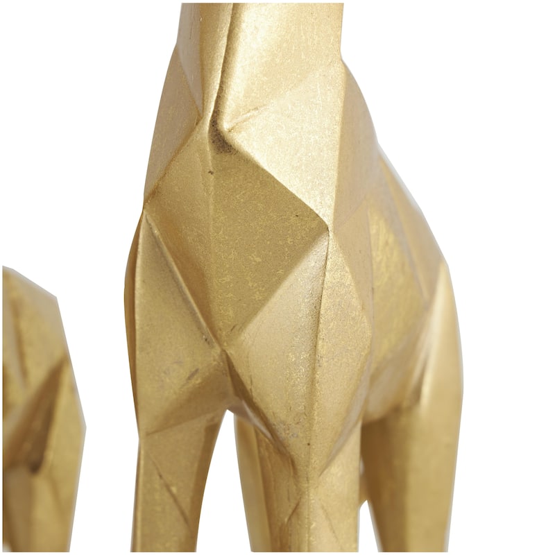 CosmoLiving by Cosmopolitan Gold or Silver Polystone Giraffe Decorative Sculpture (Set of 2)