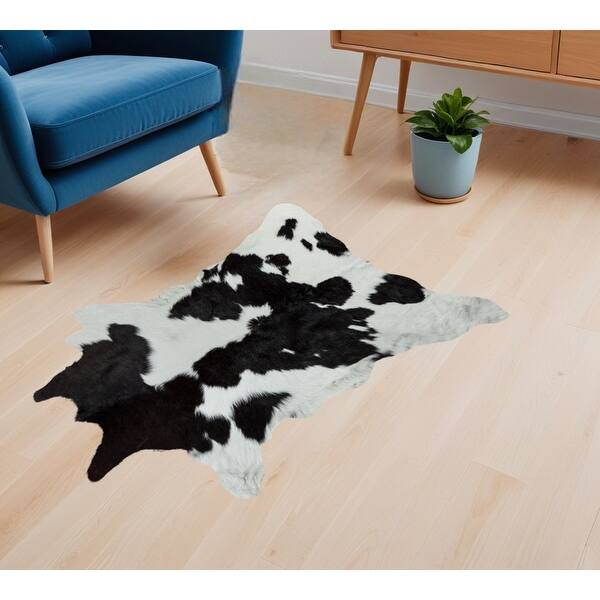 5' x 7' Light Brown and White Cowhide Hand Knotted Area Rug 5' x 7' Light Brown and White Cowhide Hand Knotted Area Rug