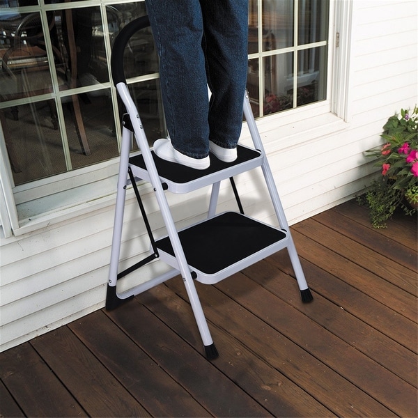 Folding step stool with outlet handle