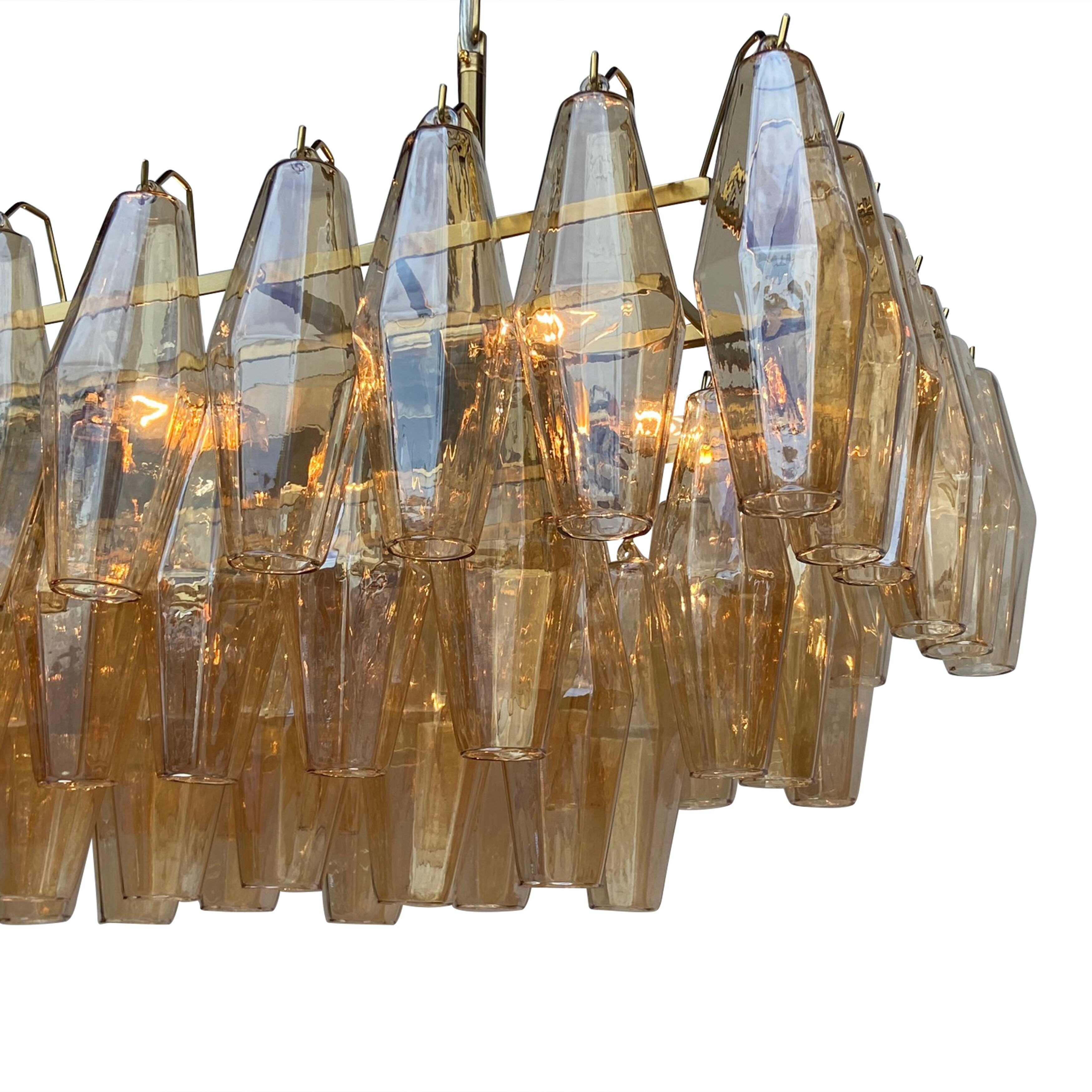 Ciara 8 Light Rectangular Linear Amber Glass Chandelier. - Brass