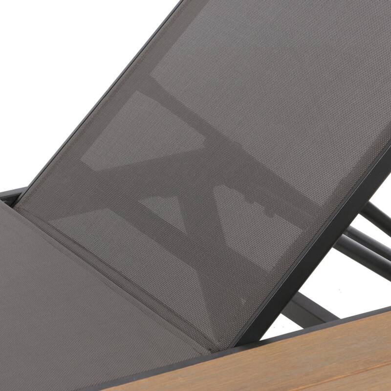 Outdoor chaise lounge with mesh seating with wooden side table
