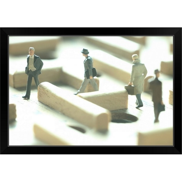 "Businessmen figurines in a maze game" Black Framed Print