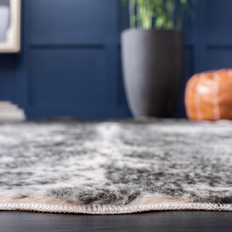 SAFAVIEH Faux Cow Hide Sinne Animal Rug