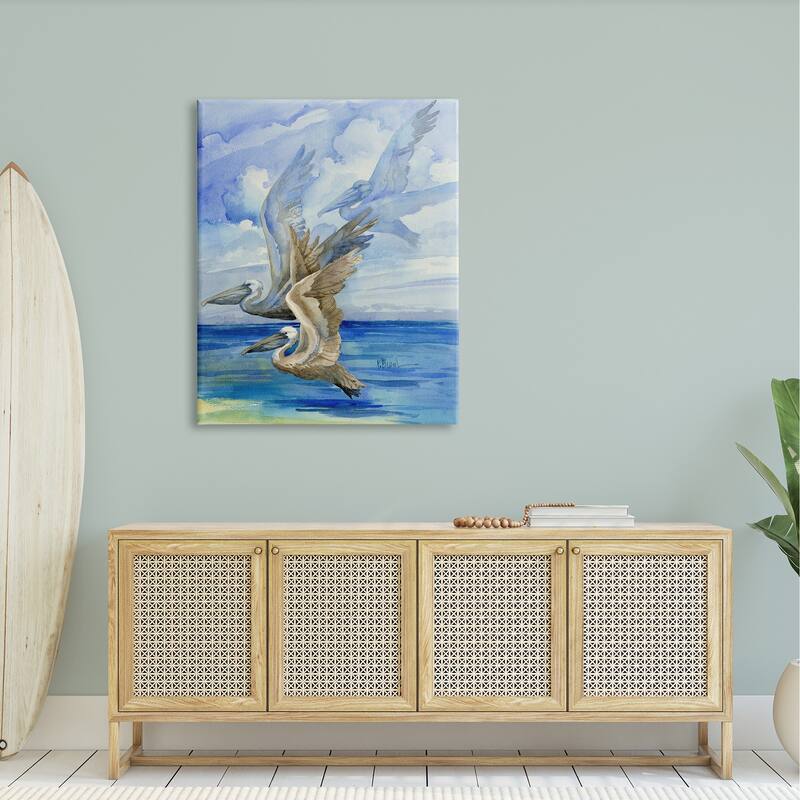 Stupell Pelicans Trio Over Ocean Shore Stretched Canvas Wall Art, Design by Paul Brent