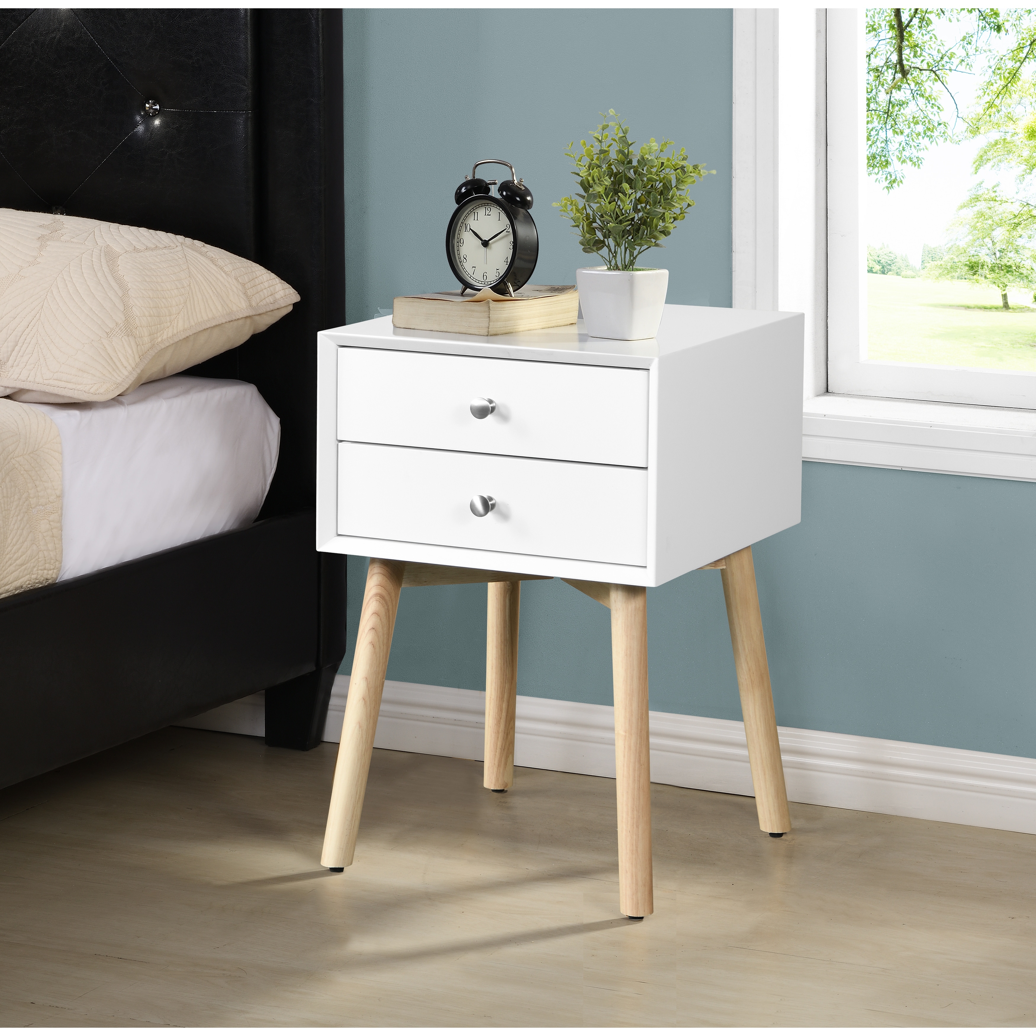 White nightstand store with wood legs