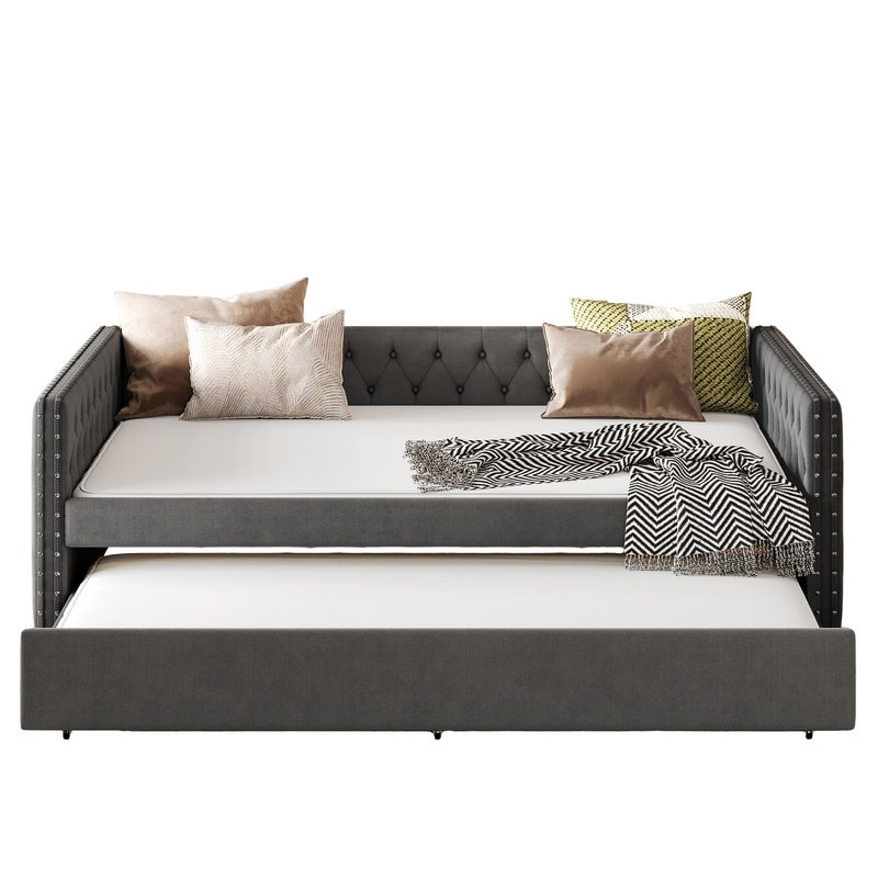 Upholstered Daybed , Sofa Bed Featuring Twin Trundle, Square Arms Adorned with Button Tufting and Copper Nail Accents‌.