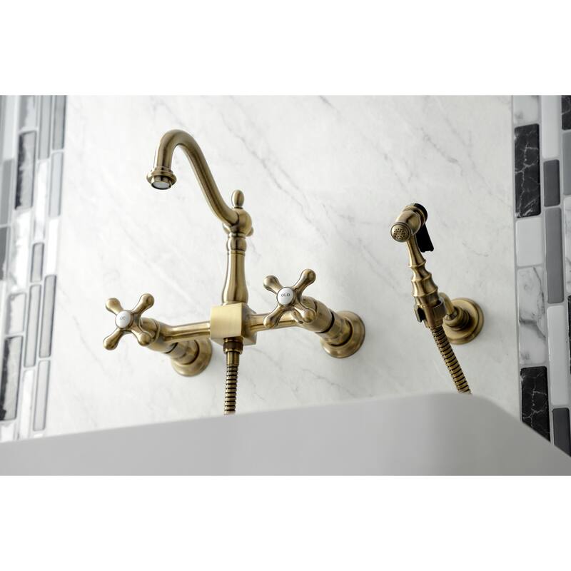 Kingston Brass Heritage Wall Mount Bridge Kitchen Faucet with Brass Sprayer - Antique Brass