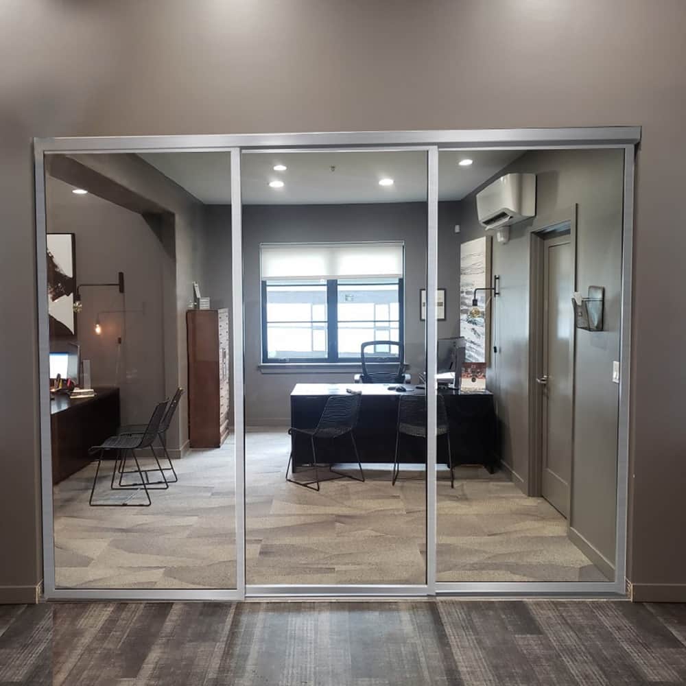 THE SLIDING DOOR COMPANY 3 Panel, Sliding Room Divider, Clear Glass and Aluminum Frame on triple track.