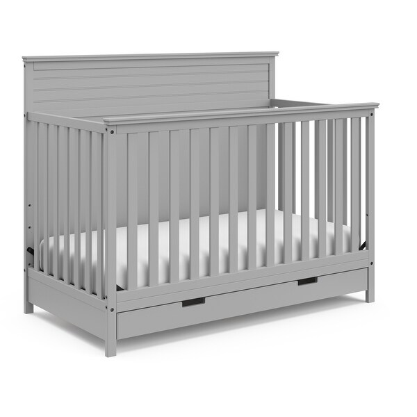 white crib with storage