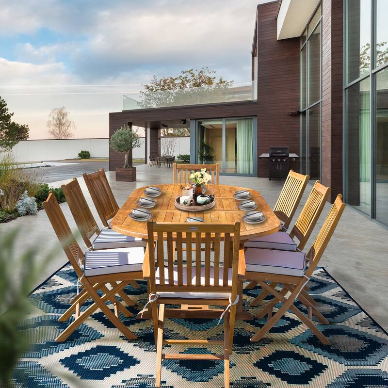 Seven Seas Teak 9 Piece Teak Wood Santa Monica Patio Dining Set with Oval Extension Table, 8 Folding Arm & Side Chairs