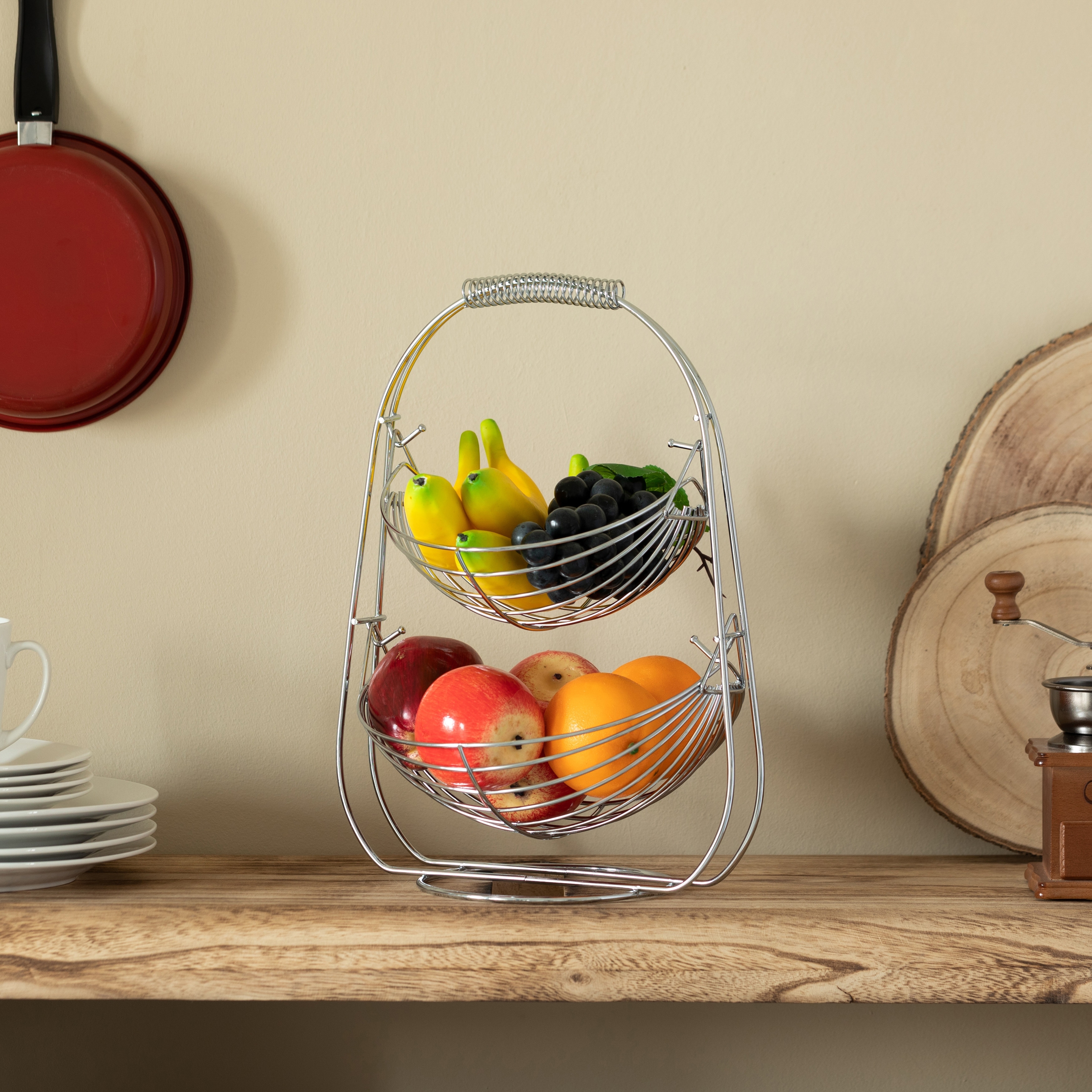 https://ak1.ostkcdn.com/images/products/is/images/direct/84874bef517fbc92c532612b1e479c98a484aaaf/2-Tier-Metal-Fruit-Holder-Swing-Basket-for-Kitchen-Detachable-Countertop-Vegetables-Storage-Organizer-with-Display-Hammock-Stand.jpg