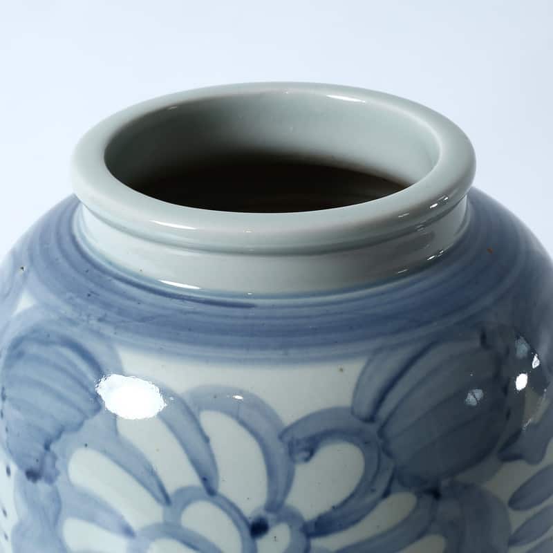 Approx. 10 Inches Tall Blue and White Vase with Flower Motif