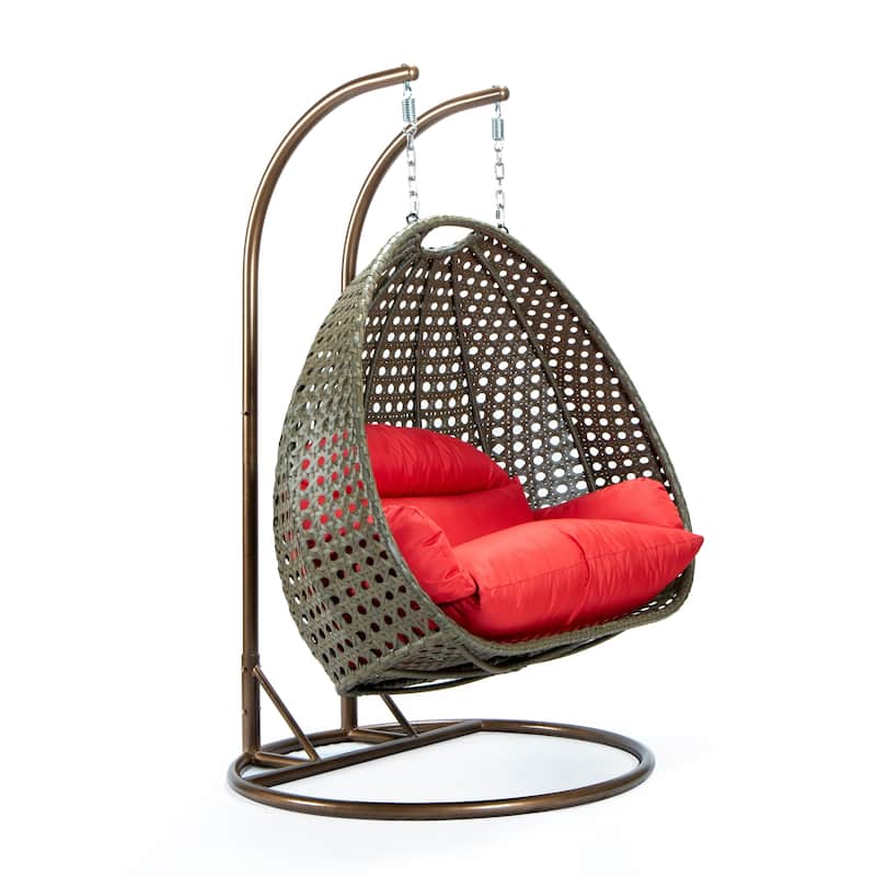 LeisureMod 2-Person Hanging Egg Swing Chair with Metal Stand - Handcrafted Beige Wicker, Patio Hammock Lounger with Cushions