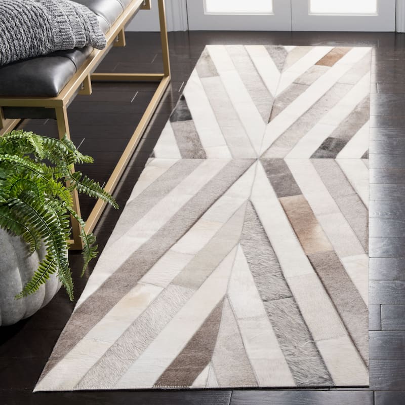 SAFAVIEH Handmade Studio Leather Maranda Mid-Century Modern Rug