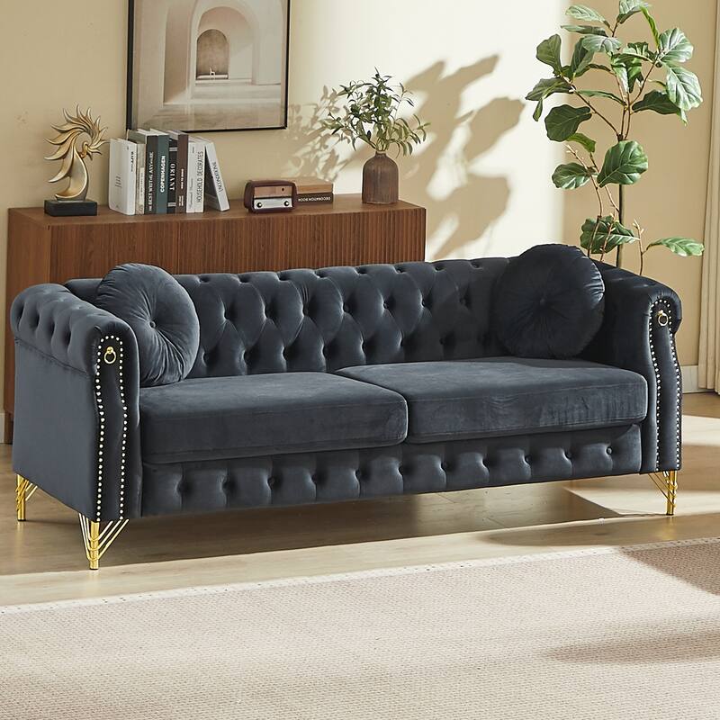 Chesterfield Sofa with Two Round Pillows, Featuring Copper Stud Detailing and Tufted Button Accents