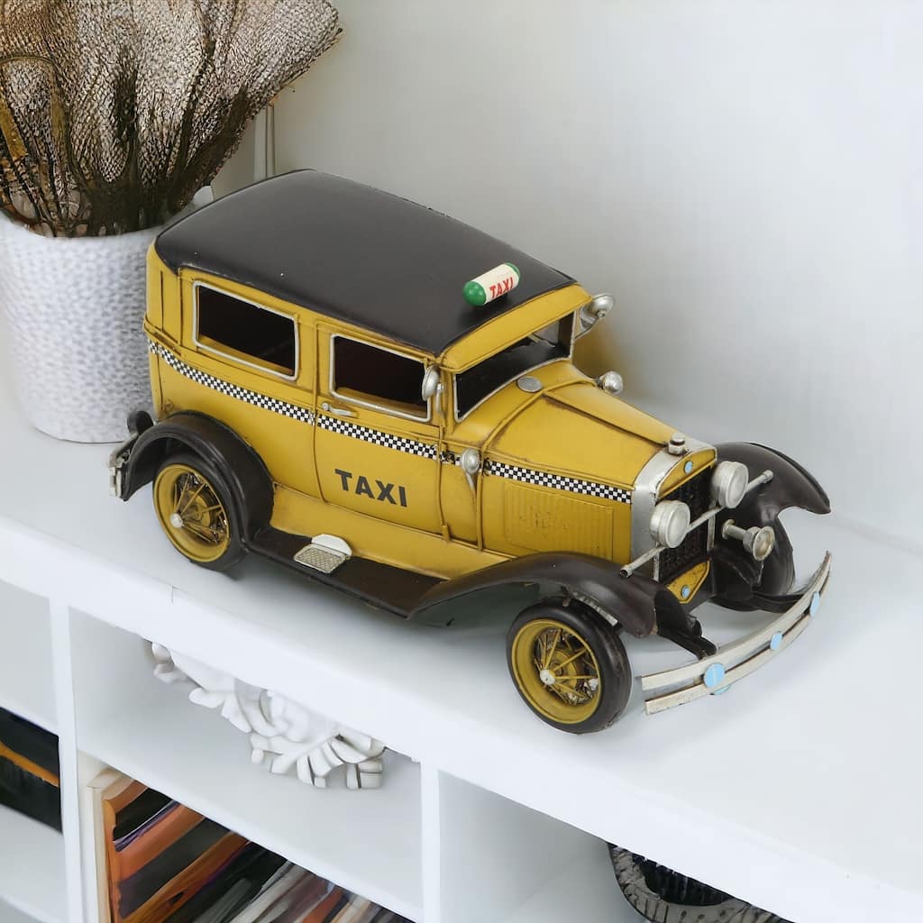 HomeRoots 7" Yellow and Black Metal Hand Painted 1931 Yellow Taxi Model Car - 6.5' X '6.5' X '13.5